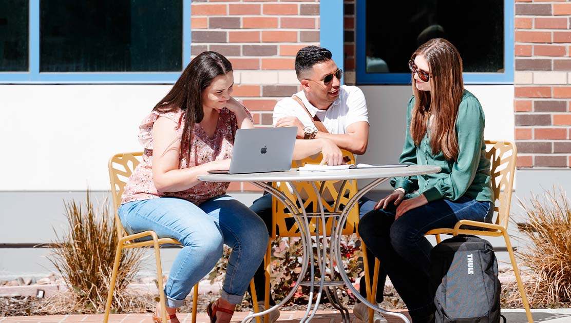 Three students at a table