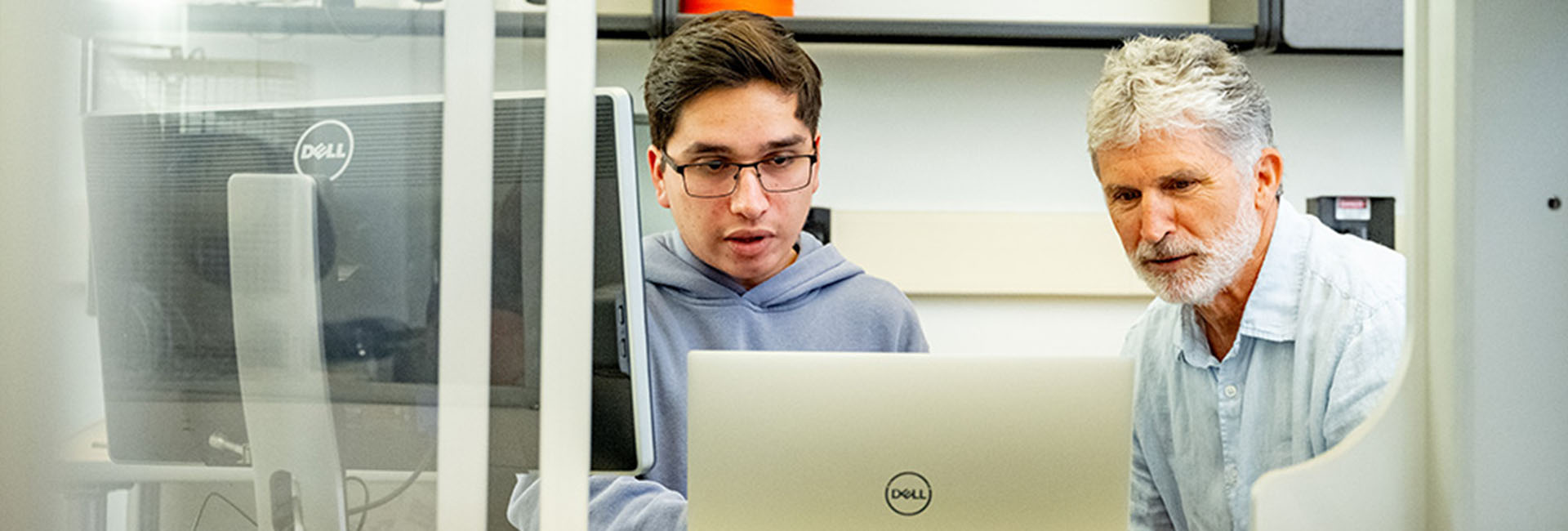 Student and professor in research lab